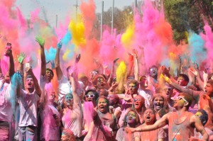 Holi participants throw the last round of color into the air before yelling "Happy Holi!" on Lee Fields on March 21, 2015. About one thousand people attended the event where they tossed colored powder onto their neighbors. Traditionally, Holi is a spring festival celebrating the Hindu deity Krishna. By: Sorena Dadgar