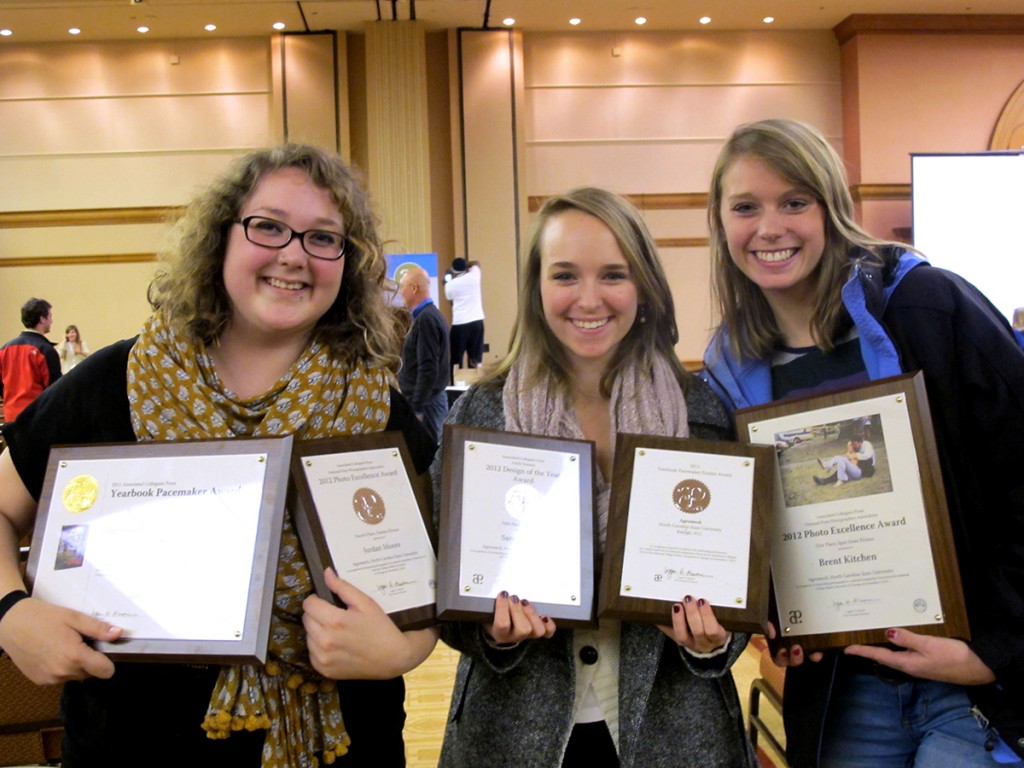 Three women hold five awards among them.