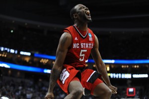 Senior guard Desmond Lee jumps and screams after N.C. State defeated Villanova during the 3rd round of the NCAA Tournament Saturday, March 21, 2015. The Wolfpack defeated the No. 1 seed Wildcats 71-68 at CONSOL Energy Center in Pittsburgh, PA to extend their run in the tournament to the Sweet Sixteen. By: Ryan Parry