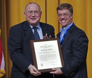 Wilson accepts award