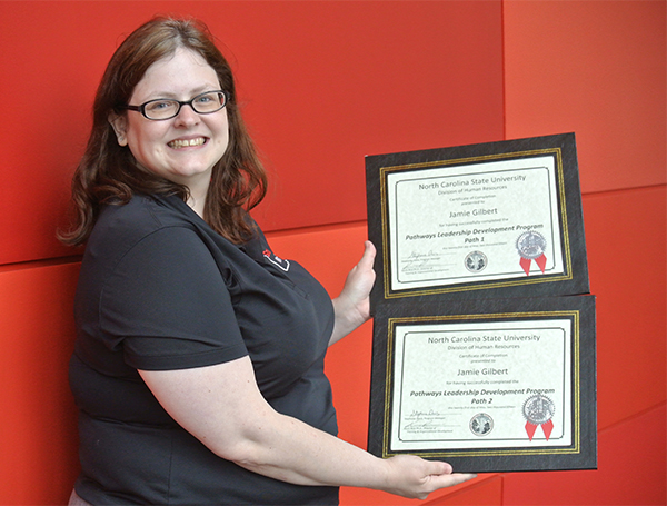 Jamie Lynn Gilbert displays her Pathways Leadership Development Program certificates of completion.