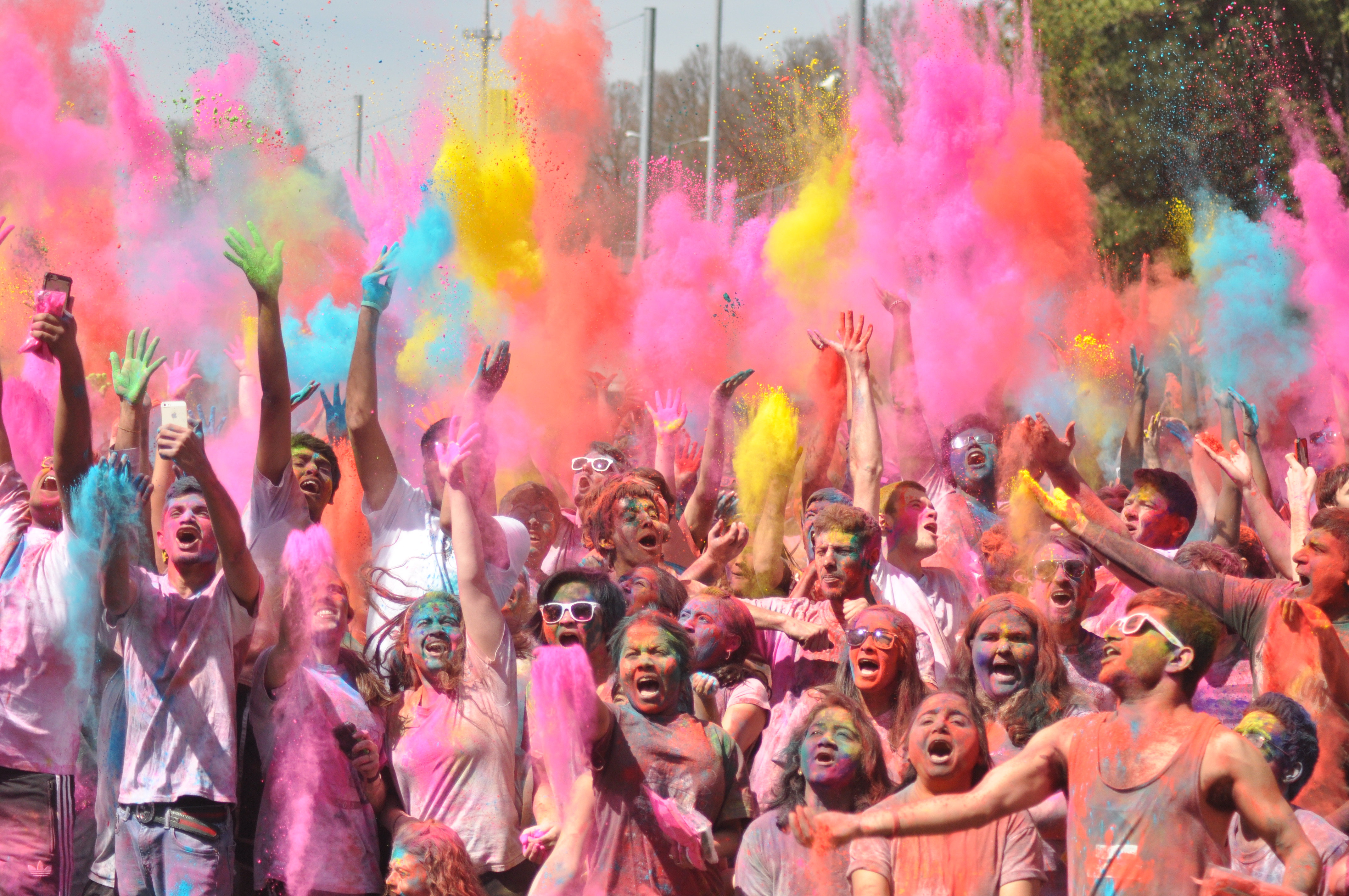 Crowd covered in color for Holi